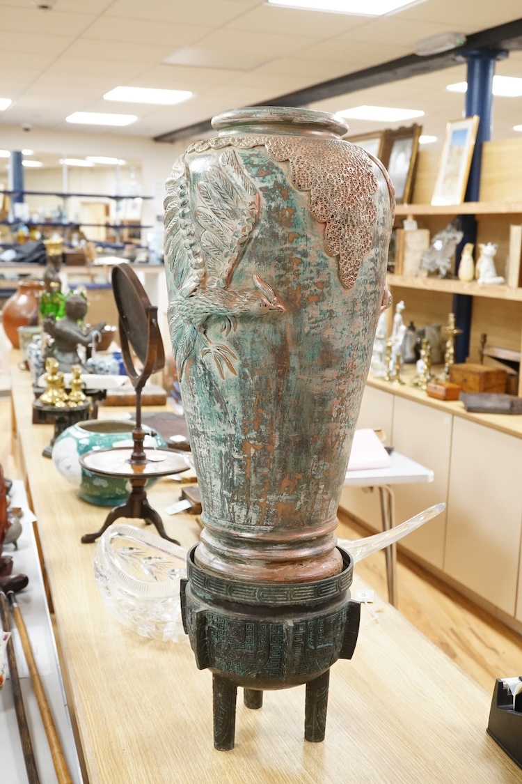 A large Chinese terracotta jar on archaistic stand, 83cm high